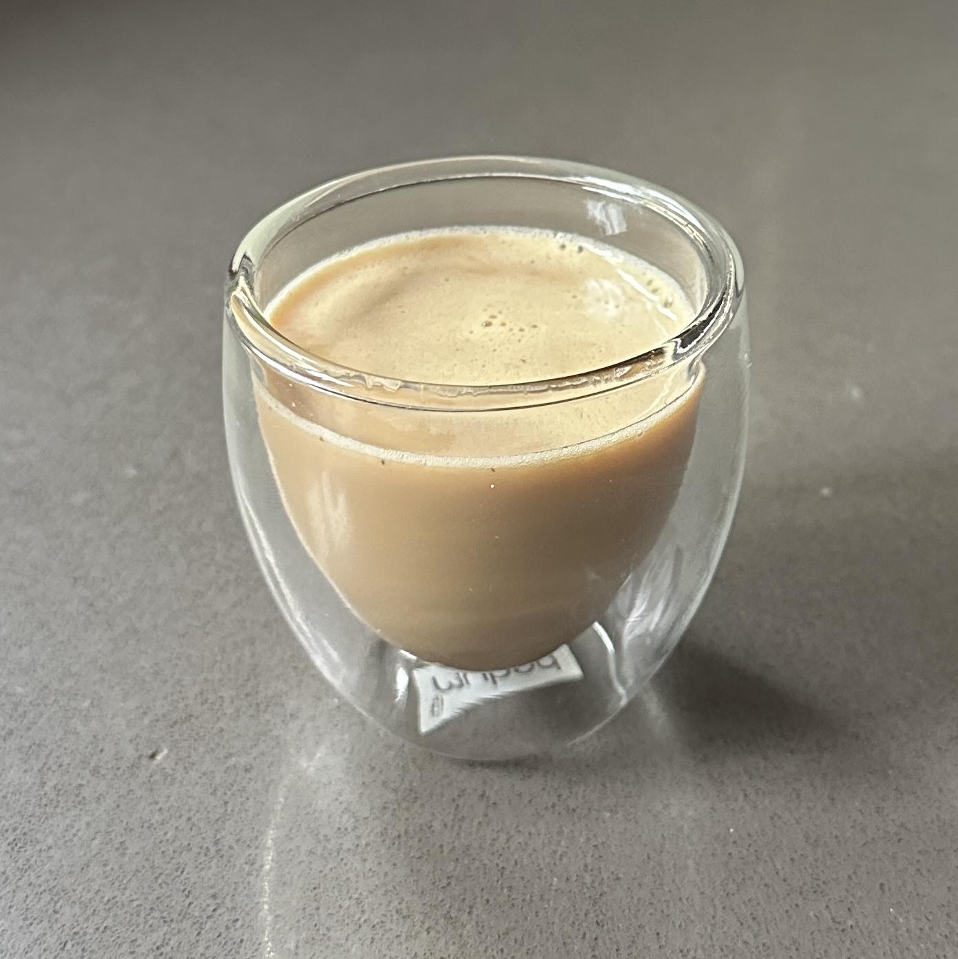 Micro pour — 2.5 oz masala chai in a double-wall glass